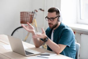 Man wearing headphones on a conference call