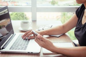 Close up of young woman home office technology
